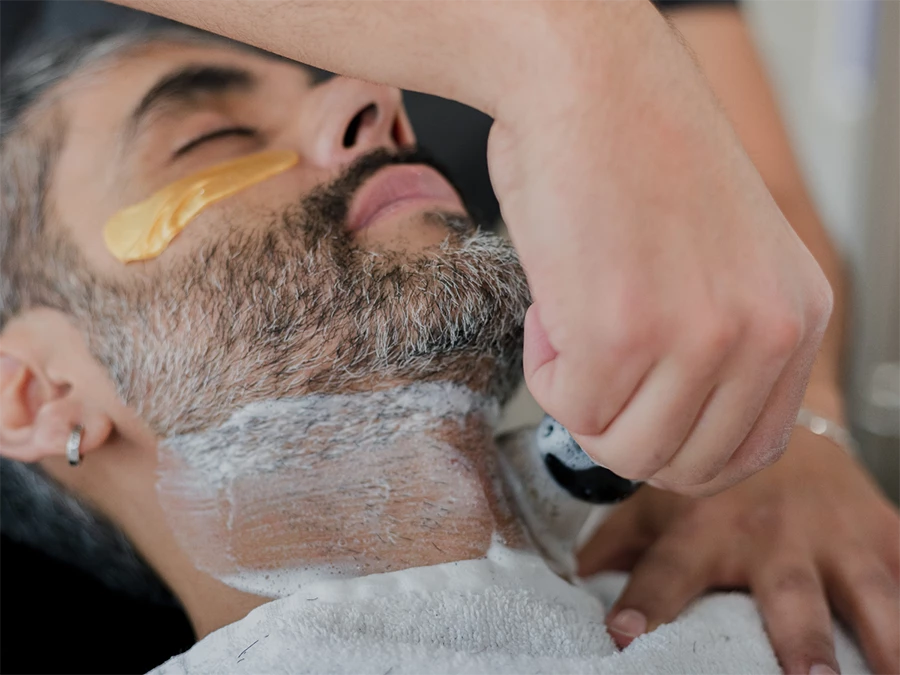 Precise clean shave barber in Meyerland area offering a traditional grooming experience.