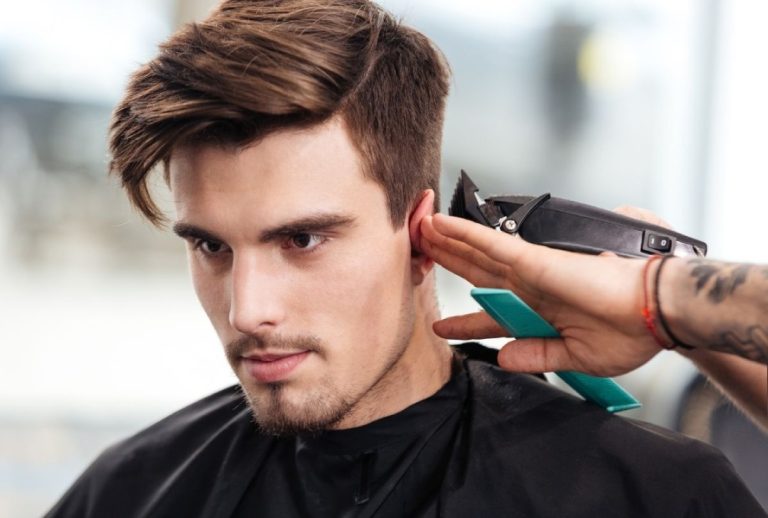 Close-up haircut using clippers at a top-rated barber shop Houston, highlighting precision grooming and modern style.
